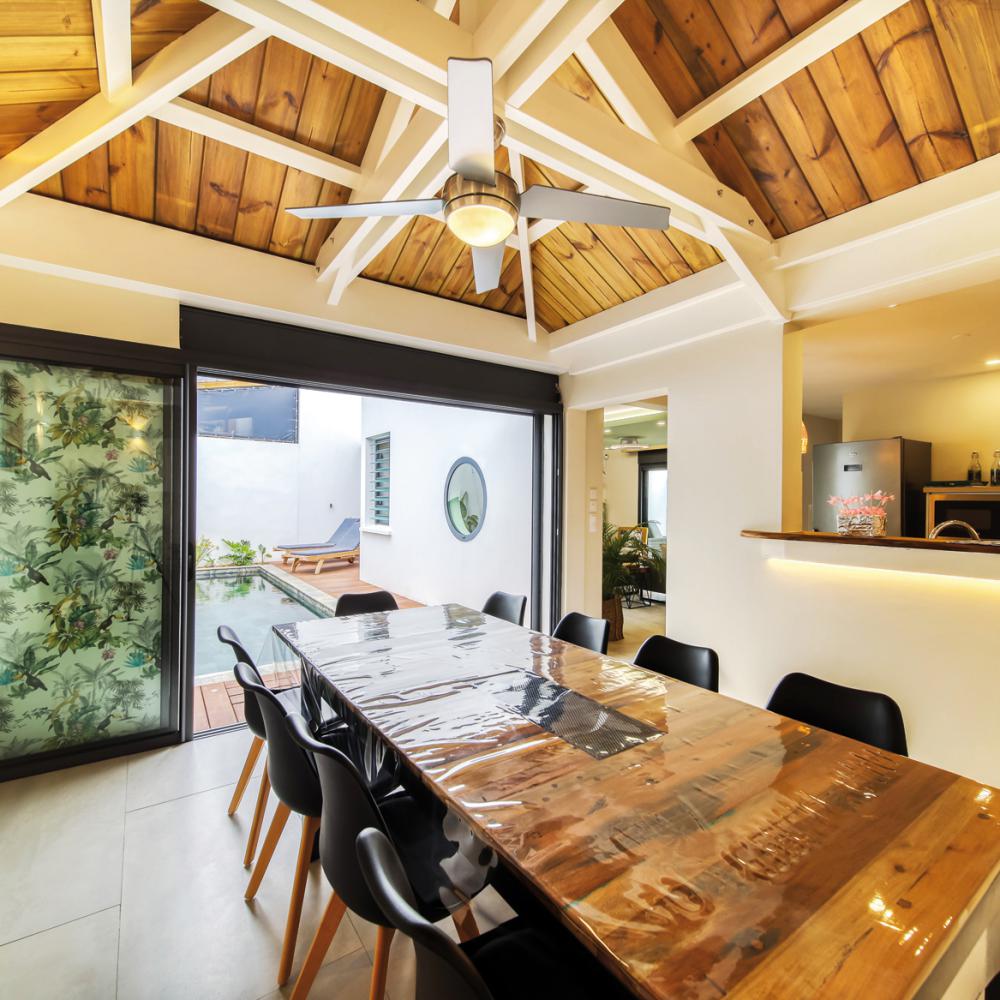 Dining room for 10 people next to the open kitchen.