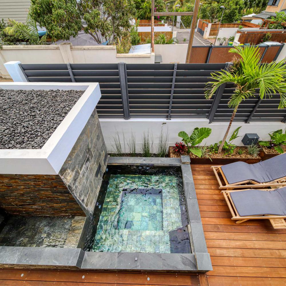 View of the heated jacuzzi and runoff wall- 8 places and outdoor space.