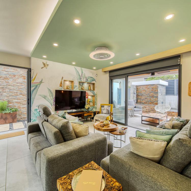 Living room with home cinema, view on jaccuzzi.